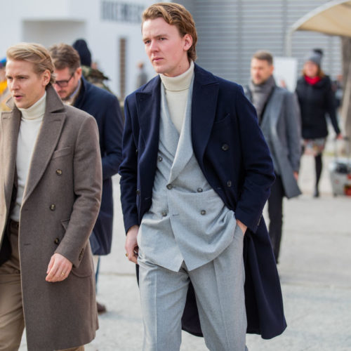 FLORENCE, ITALY - JANUARY 07: A guest is seen wearing navy double breasted wool coat during Pitti Uomo 97 at Fortezza Da Basso on January 07, 2020 in Florence, Italy. (Photo by Christian Vierig/Getty Images)